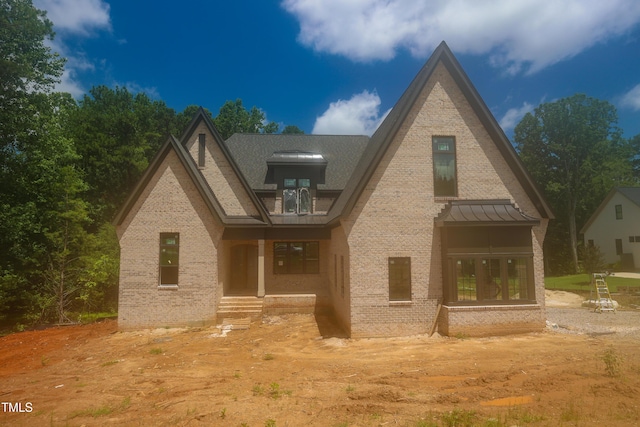 2305 Ballywater Lea Way, Wake Forest, NC 27587 - view of front of house featuring brick siding, a standing seam roof, and french doors