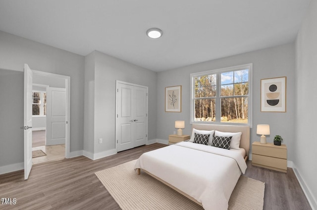 1101 Ridge Rd, Roxboro, NC 27573 - bedroom with wood finished floors, baseboards, and a closet