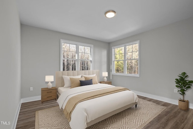 1101 Ridge Rd, Roxboro, NC 27573 - bedroom featuring baseboards and dark wood-type flooring
