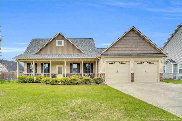 craftsman house with a front lawn, concrete driveway, covered porch, brick siding, and a garage
