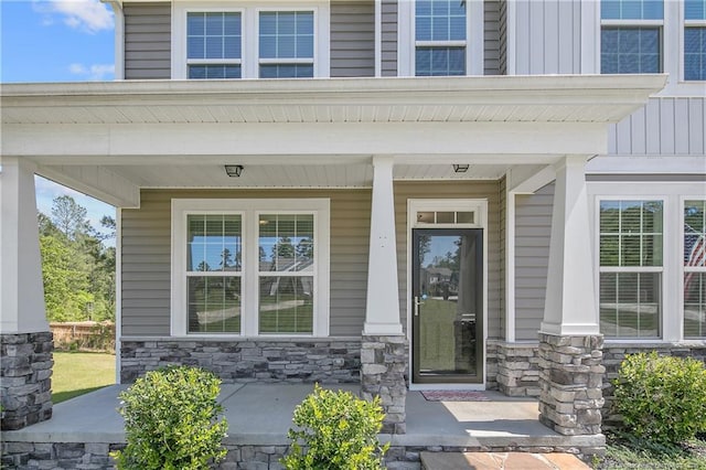 99 Wildlife Bridge Ct, Spring Lake, NC 28390 - entrance to property with covered porch, board and batten siding, and stone siding