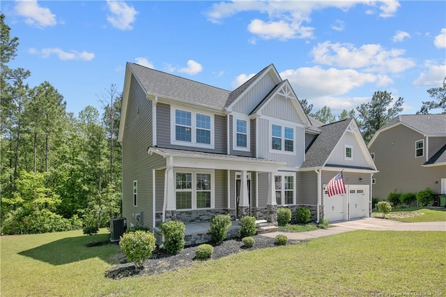 99 Wildlife Bridge Ct, Spring Lake, NC 28390 - craftsman house featuring an attached garage, board and batten siding, a front yard, covered porch, and driveway