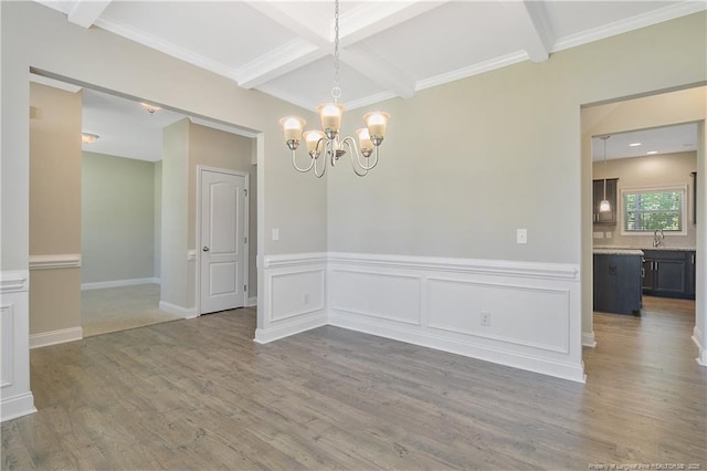 99 Wildlife Bridge Ct, Spring Lake, NC 28390 - unfurnished dining area featuring beamed ceiling, coffered ceiling, wood finished floors, and a chandelier