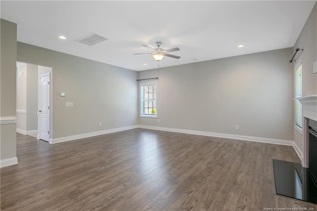 99 Wildlife Bridge Ct, Spring Lake, NC 28390 - unfurnished living room with a ceiling fan, baseboards, visible vents, and dark wood-type flooring