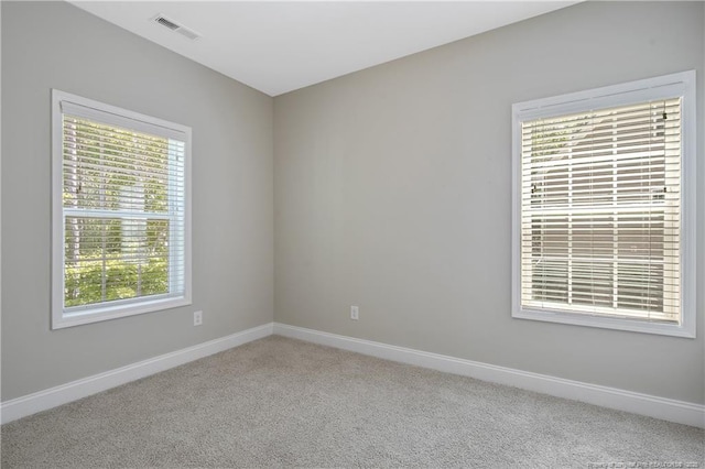 99 Wildlife Bridge Ct, Spring Lake, NC 28390 - empty room with baseboards, carpet, and visible vents