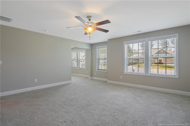 99 Wildlife Bridge Ct, Spring Lake, NC 28390 - spare room featuring visible vents, baseboards, ceiling fan, and a healthy amount of sunlight