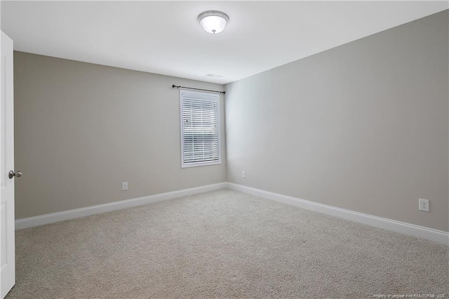 99 Wildlife Bridge Ct, Spring Lake, NC 28390 - unfurnished room with baseboards and carpet