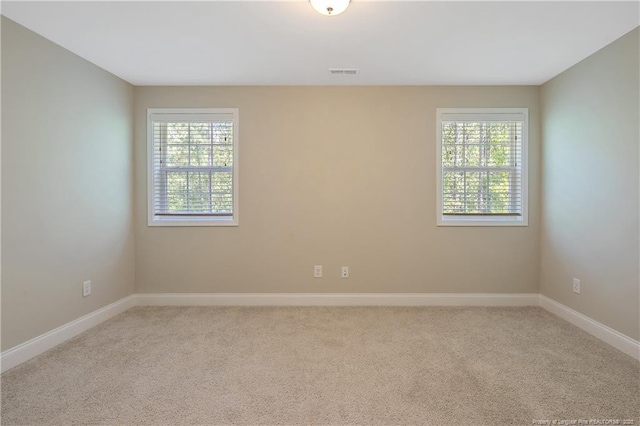 99 Wildlife Bridge Ct, Spring Lake, NC 28390 - carpeted empty room featuring baseboards and visible vents