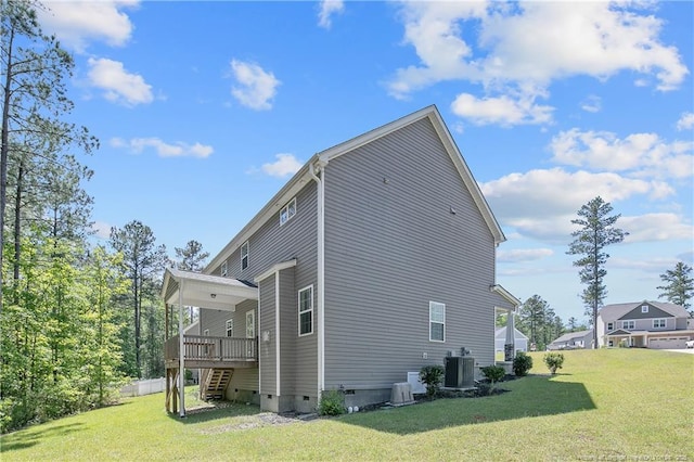 99 Wildlife Bridge Ct, Spring Lake, NC 28390 - view of side of home with a lawn, central AC unit, a deck, and crawl space