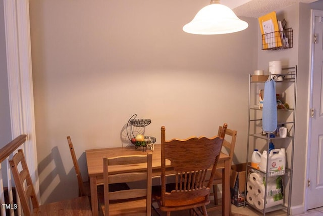 dining space with baseboards