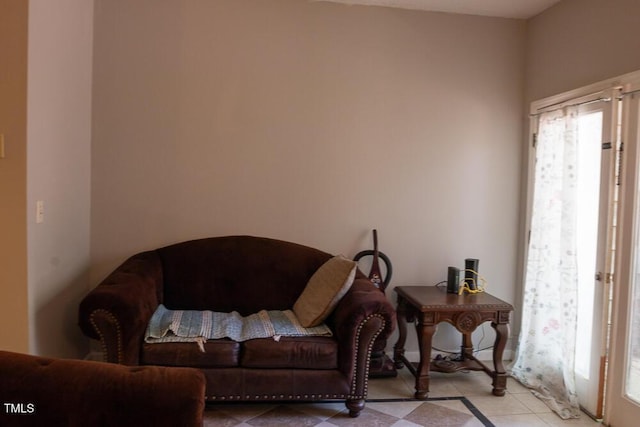 living area with light tile patterned floors