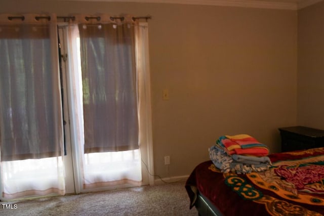 bedroom with carpet floors and ornamental molding