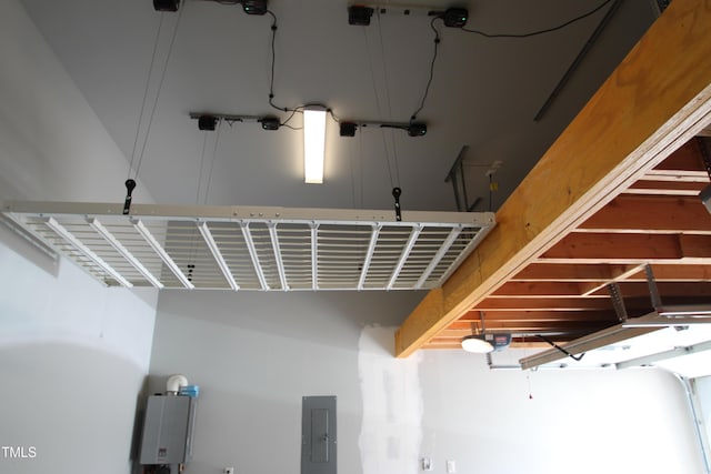 room details featuring a garage door opener and electric panel