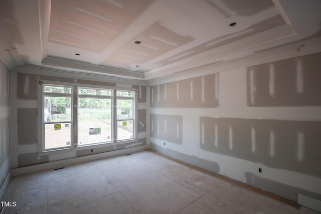 empty room with a tray ceiling