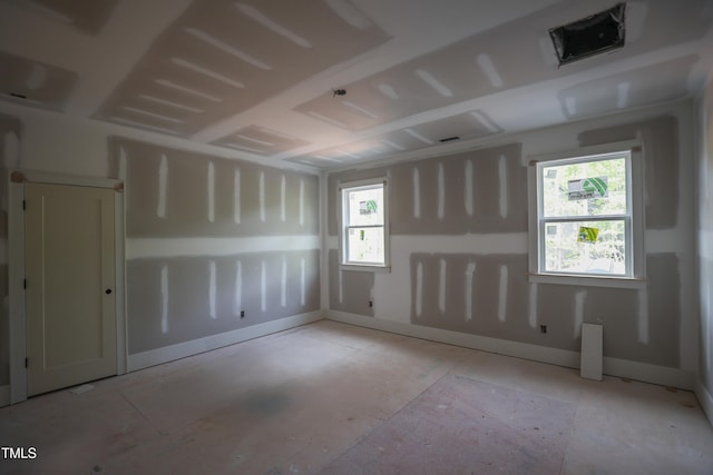 spare room featuring baseboards