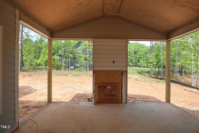 view of patio featuring a forest view