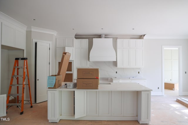 7301 Wexford Woods Ln, Wake Forest, NC 27587 - kitchen featuring a center island, custom range hood, and white cabinetry