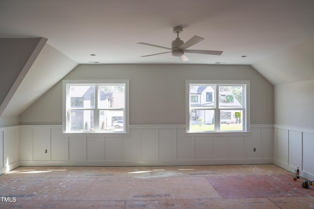 7301 Wexford Woods Ln, Wake Forest, NC 27587 - bonus room with lofted ceiling, a wainscoted wall, and a ceiling fan