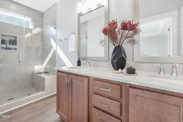 3022 White Rail Dr, Fuquay Varina, NC 27526 - bathroom with a shower stall, wood finished floors, and double vanity