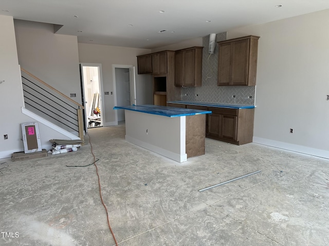 3022 White Rail Dr, Fuquay Varina, NC 27526 - kitchen featuring backsplash and a center island