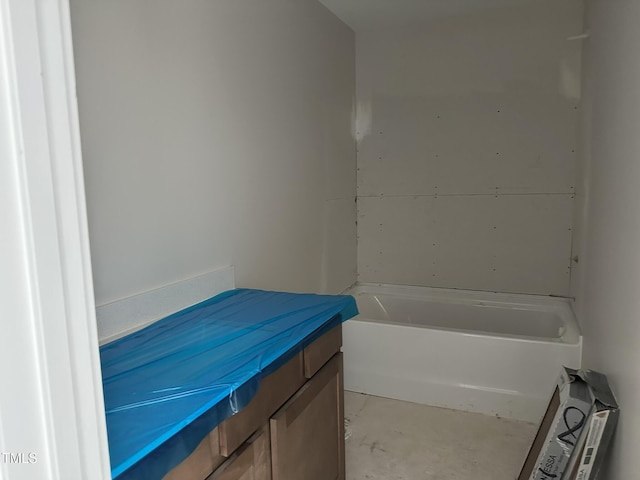 3022 White Rail Dr, Fuquay Varina, NC 27526 - bathroom featuring a bathtub, vanity, and unfinished concrete floors