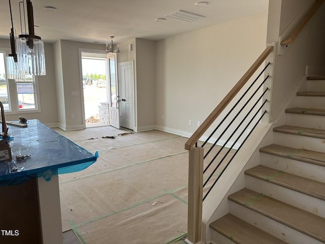 3022 White Rail Dr, Fuquay Varina, NC 27526 - foyer entrance featuring stairway and baseboards