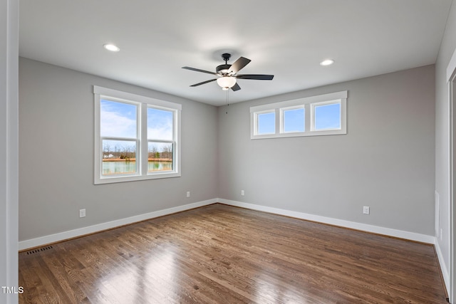 unfurnished room featuring wood finished floors, a ceiling fan, baseboards, and recessed lighting