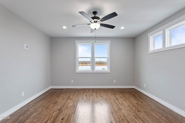 empty room featuring wood finished floors, baseboards, recessed lighting, and ceiling fan