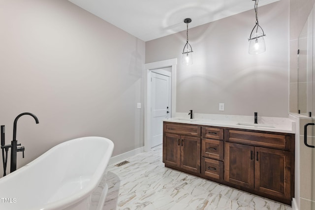 bathroom featuring a soaking tub, visible vents, marble finish floor, and a sink