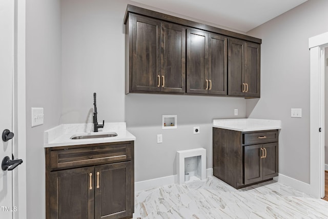 laundry room featuring marble finish floor, a sink, hookup for an electric dryer, cabinet space, and washer hookup