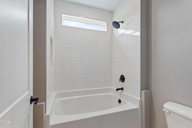 full bathroom featuring tub / shower combination and toilet