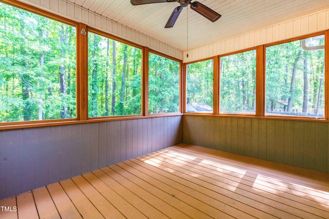 unfurnished sunroom with wood-type flooring