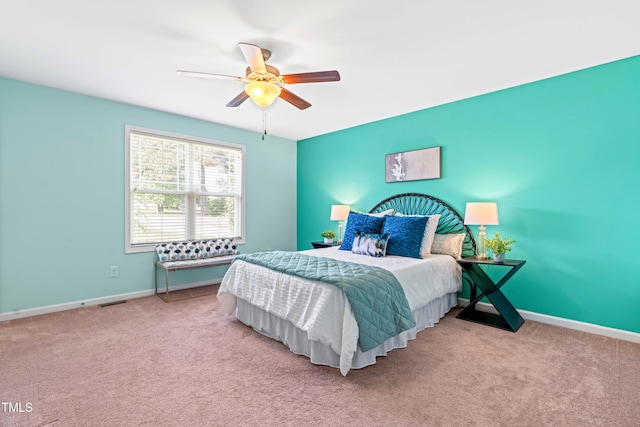 bedroom with baseboards, ceiling fan, and carpet flooring