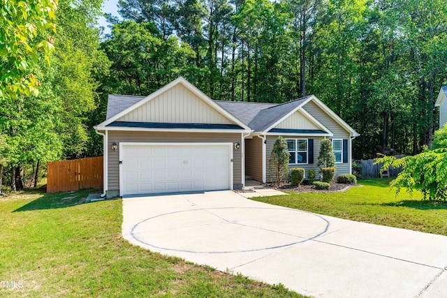 ranch-style home featuring fence, an attached garage, driveway, and a front yard