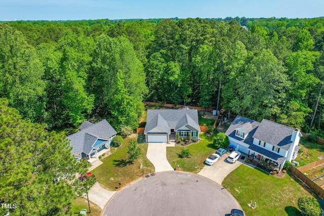 drone / aerial view featuring a view of trees