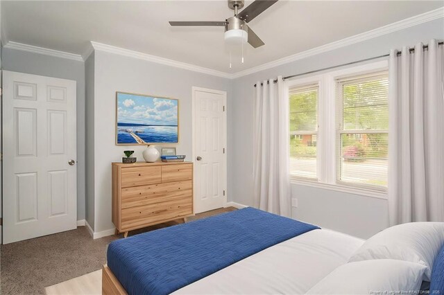 1016 Martindale Dr, Fayetteville, NC 28304 - carpeted bedroom with ceiling fan, baseboards, and ornamental molding