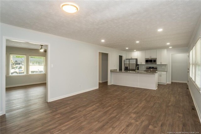 1016 Martindale Dr, Fayetteville, NC 28304 - unfurnished living room with a textured ceiling and crown molding