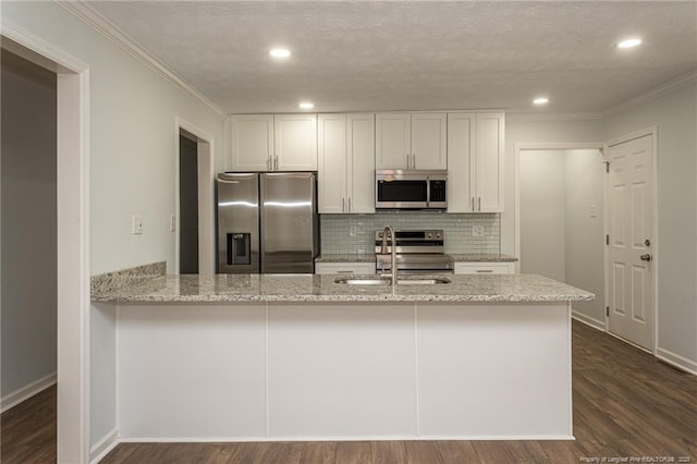 1016 Martindale Dr, Fayetteville, NC 28304 - kitchen with ornamental molding, tasteful backsplash, stainless steel appliances, and a sink
