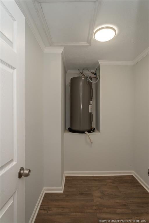 1016 Martindale Dr, Fayetteville, NC 28304 - interior space featuring baseboards, wood finished floors, water heater, and ornamental molding