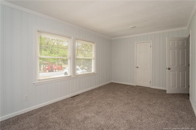 1016 Martindale Dr, Fayetteville, NC 28304 - carpeted spare room featuring baseboards, ornamental molding, and visible vents