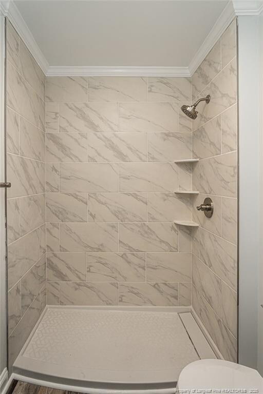 1016 Martindale Dr, Fayetteville, NC 28304 - full bath with toilet, a stall shower, and ornamental molding