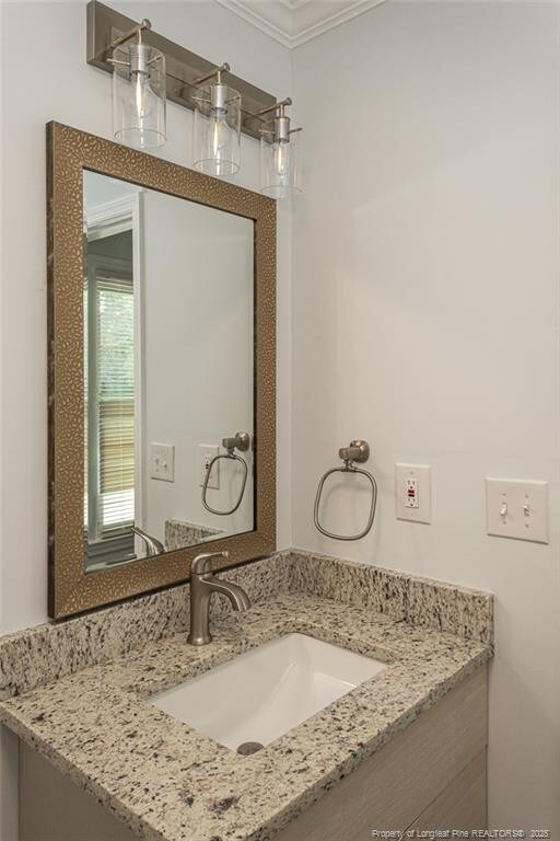 1016 Martindale Dr, Fayetteville, NC 28304 - bathroom with ornamental molding and vanity