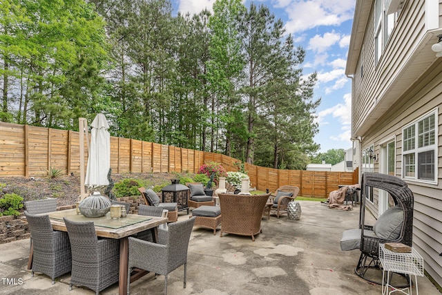 view of patio / terrace featuring a fenced backyard and outdoor dining space