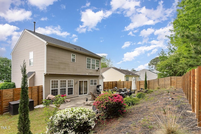 back of property featuring a patio area and a fenced backyard