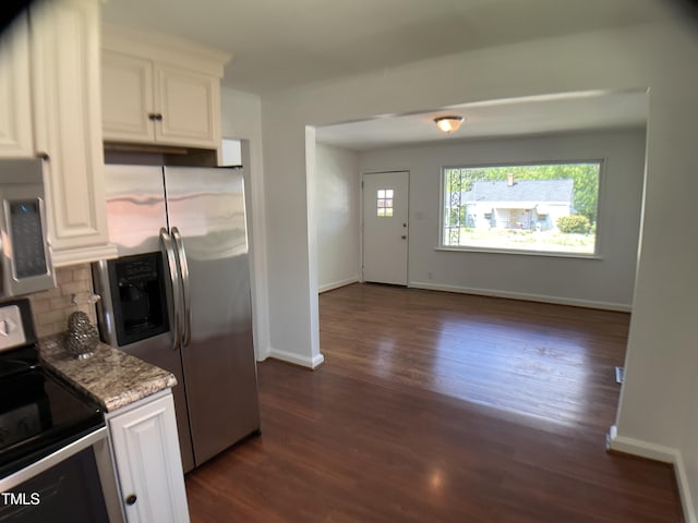 509 Coleman St, Raleigh, NC 27610 - kitchen featuring light stone counters, decorative backsplash, stainless steel appliances, white cabinetry, and dark wood-style flooring