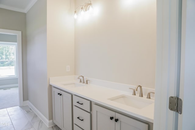155 Diamond Creek Dr, Zebulon, NC 27597 - bathroom with baseboards, marble finish floor, crown molding, and a sink