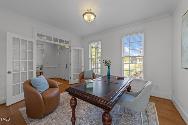 office space with baseboards, ornamental molding, french doors, and wood finished floors