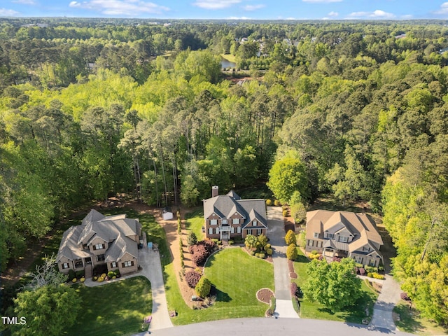 aerial view featuring a residential view and a view of trees