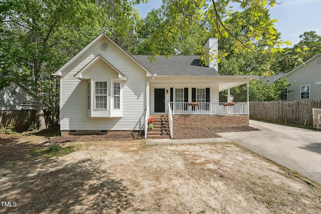 2028 Ruddy Rd, Raleigh, NC 27616 - view of front of home featuring fence, a chimney, covered porch, and crawl space