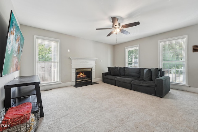 2028 Ruddy Rd, Raleigh, NC 27616 - living room with a fireplace with flush hearth, plenty of natural light, a ceiling fan, and carpet floors